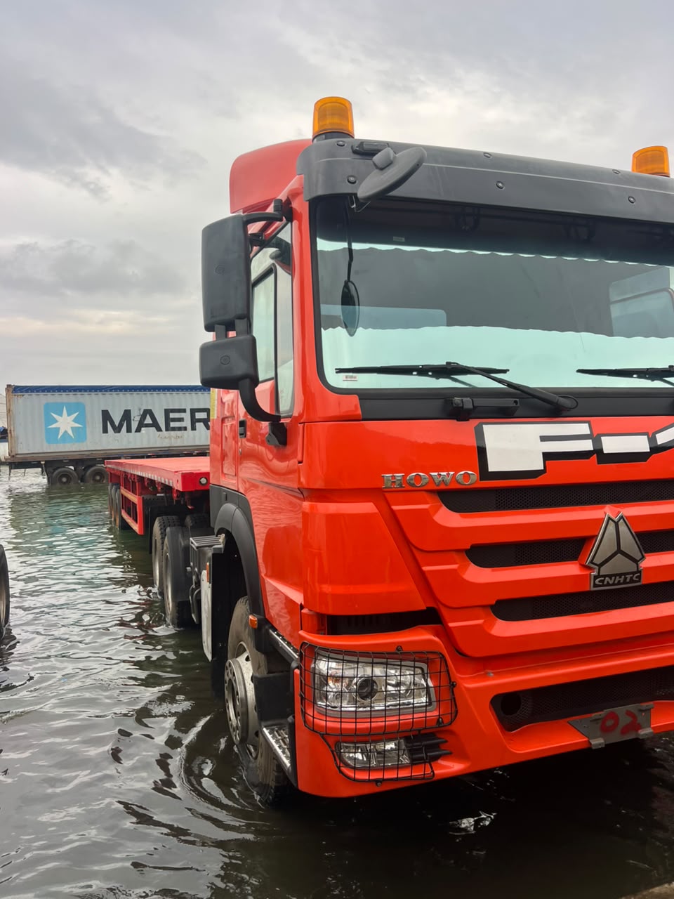 Cargo vessel at sea unloading containers